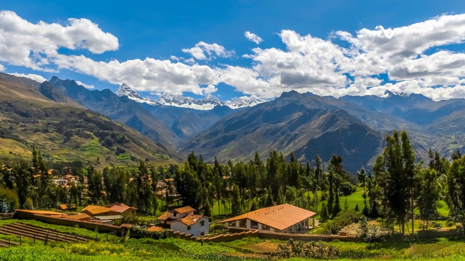 Scenic view of Yanama village in Yungay, Huaraz, surrounded by the Cordillera Blanca peaks in the Peruvian Andes – top landscape to see in Huaraz.